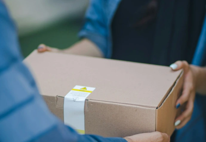 person giving brown box